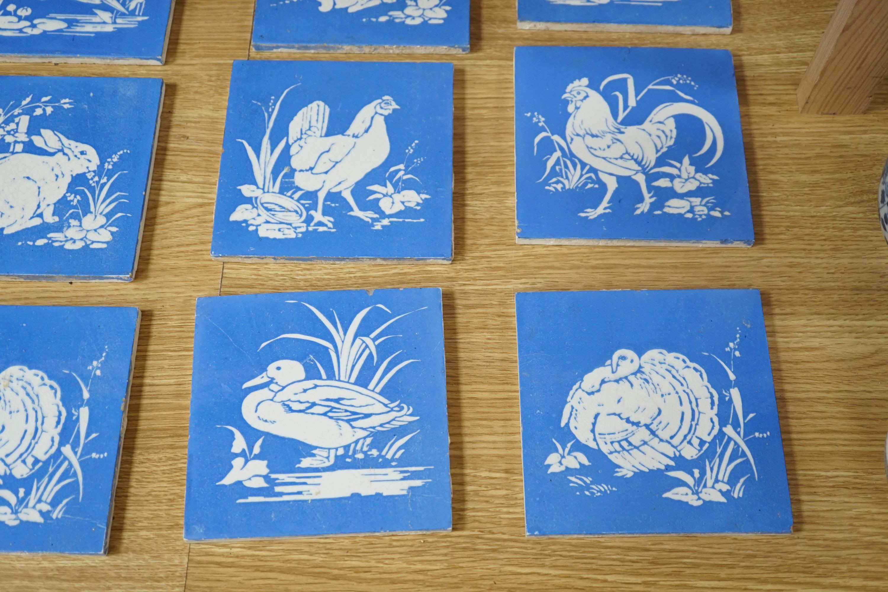 A collection of twelve Mintons China Works blue and white bird tiles, 15cms x 15cms square (each tile).
